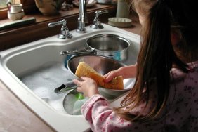 Girl washing dishes