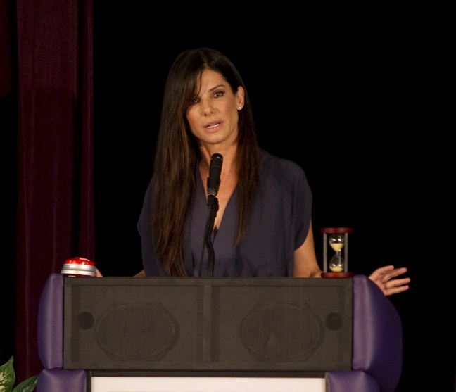 Sandra Bullock, navy dress, necklace, podium