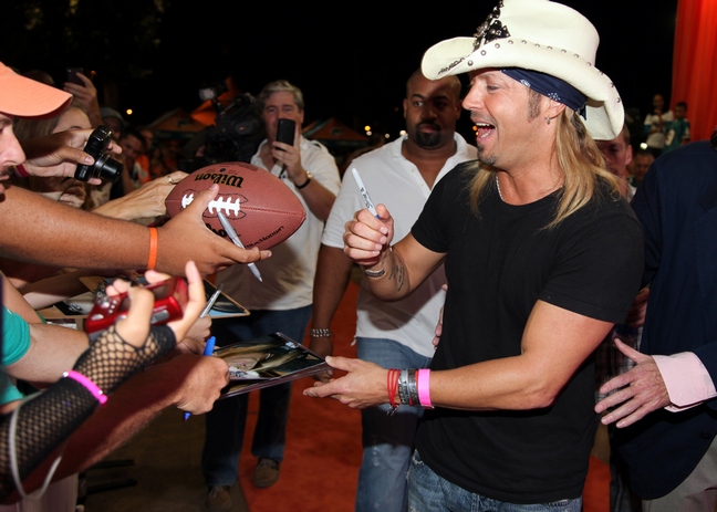 Bret Michaels, cowboy hat, black tshirt, bracelets, jeans