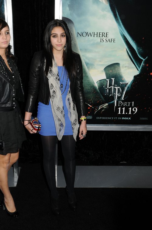 Lourdes, blue dress, black tights, black jacket