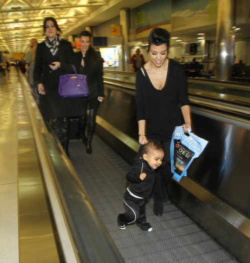 Kourtney Kardashian, black top, black pants