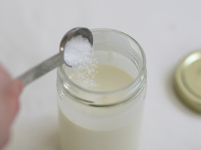 pouring salt in mason jar