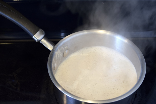 Boiling milk on stove