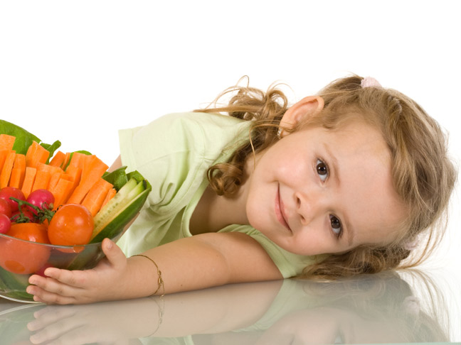 Little girl with vegetables