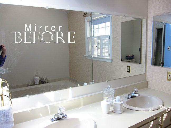 large frameless bathroom mirror before the moulding was added