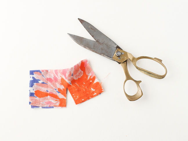 cutting colorful fabric for serving spoons