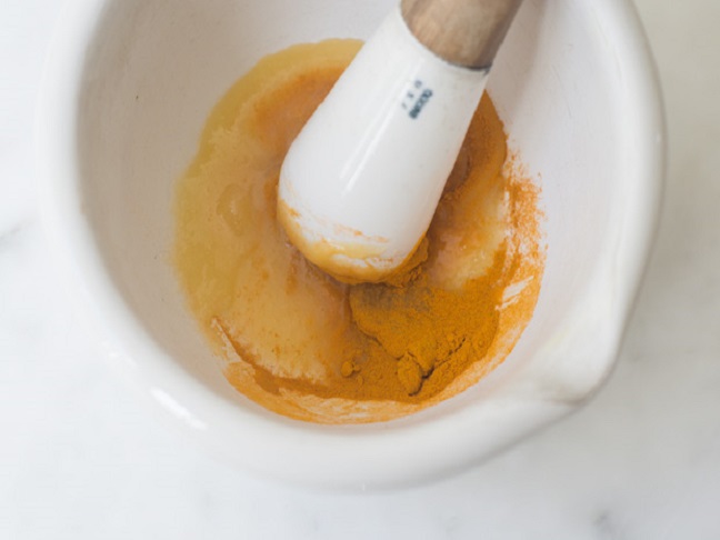 tumeric in a pestle bowl