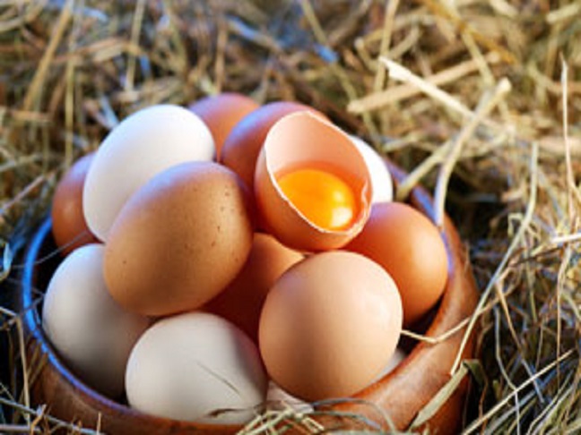 a basket of egg with one cracked open