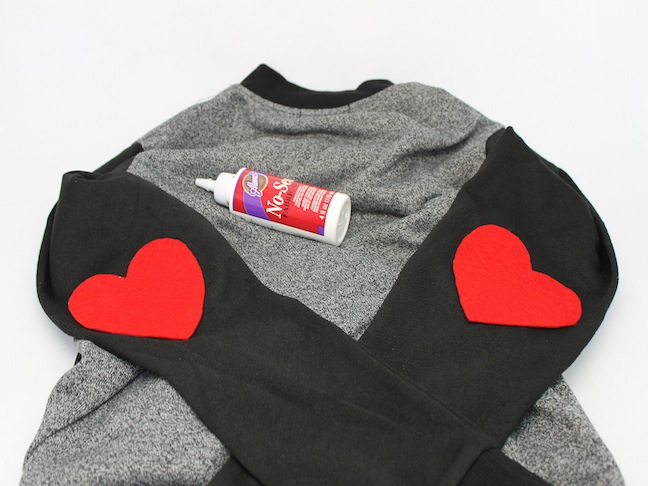 Step 2 glue felt hearts to jacket