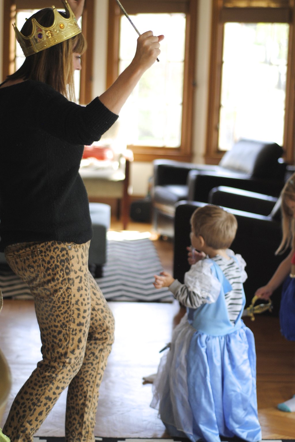 family dancing while dressed up in costumes