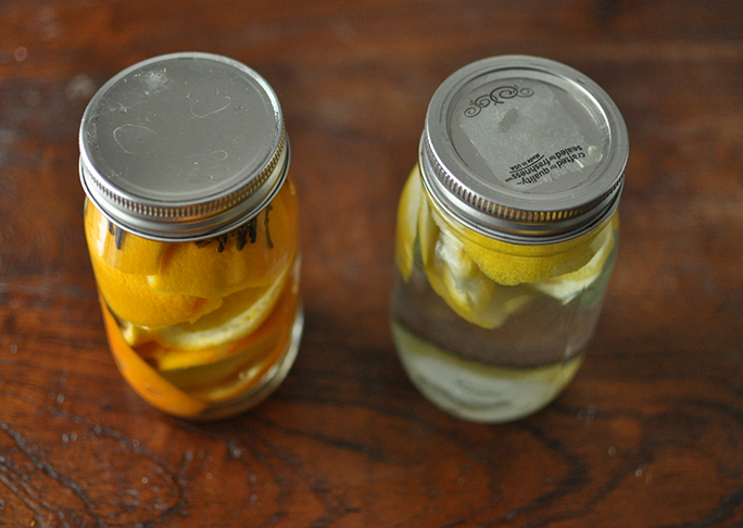 lemon and orange all natural household cleaner in mason jars