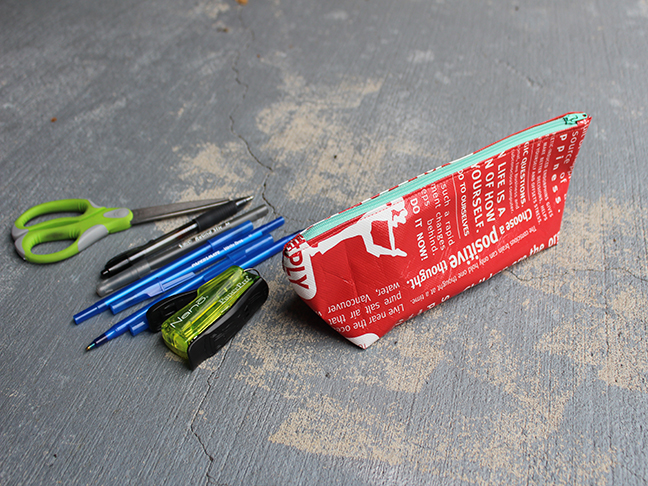 red zipper pouch pens stapler