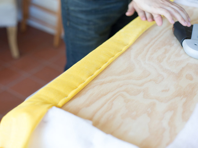 yellow-velvet-stapled-to-bench-seat