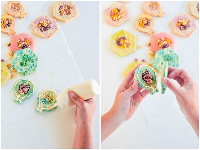 combining two sugar cookies with frosting