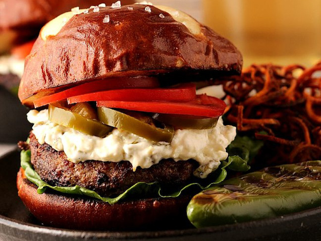 pretzel bun burger with potato salad