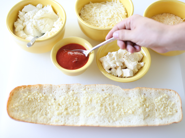 hand spoon marinara garlic bread pizza