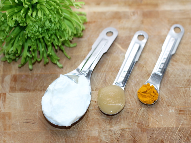 honey yogurt turmeric on spoons