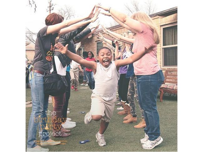 kid running under adult arms