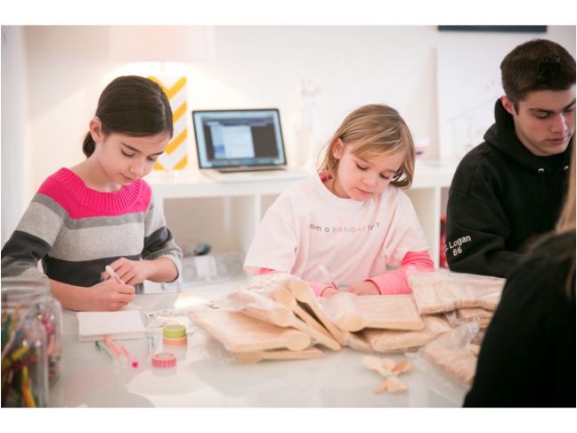 kids writing at table