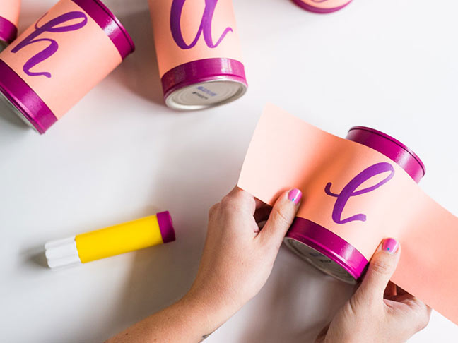 Attach paper to cans for centerpiece