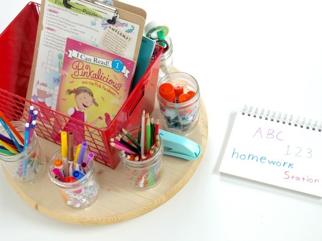 DIY-turntable-homework-station-with-school-supplies-markers-stapler-red-metal-basket-on-a-round-wooden-table DIY-turntable-homework-station-with-school-supplies-markers-stapler-red-metal-basket-on-a-round-wooden-table