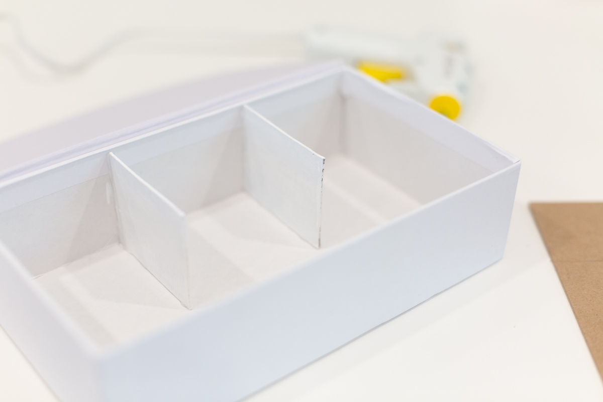 Chipboard glued into pencil box Chipboard glued into pencil box