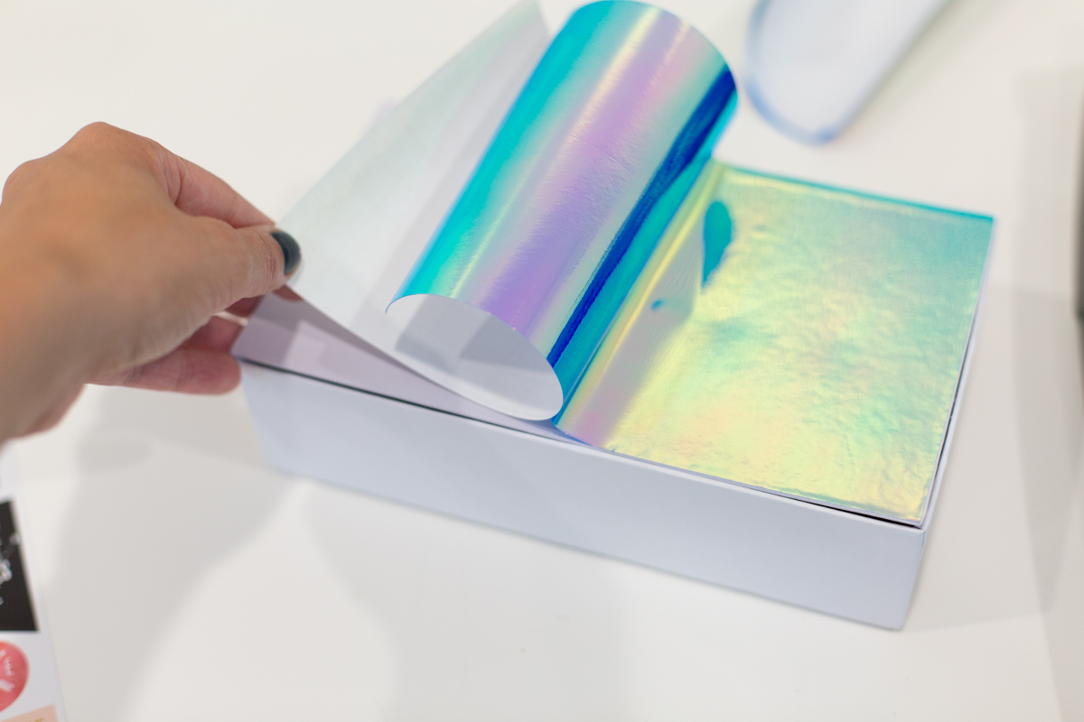 Placing vinyl on top of white pencil box Placing vinyl on top of white pencil box