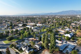 Aerial view of Ontario city in California with mountains in the background