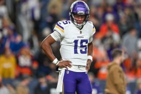 Joshua Dobbs #15 of the Minnesota Vikings warms up before a game against the Denver Broncos at Empower Field at Mile High on November 19, 2023 in Denver, Colorado.