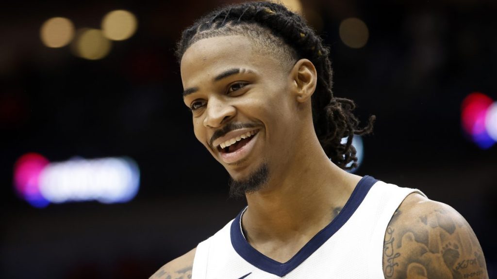 Ja Morant #12 of the Memphis Grizzlies looks on while playing the New Orleans Pelicans at Smoothie King Center on December 19, 2023 in New Orleans, Louisiana.