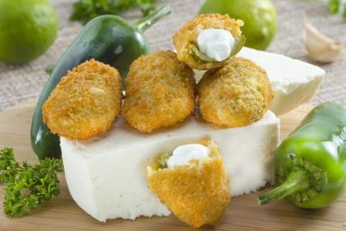 Mexican-american jalapeno poppers served with lime