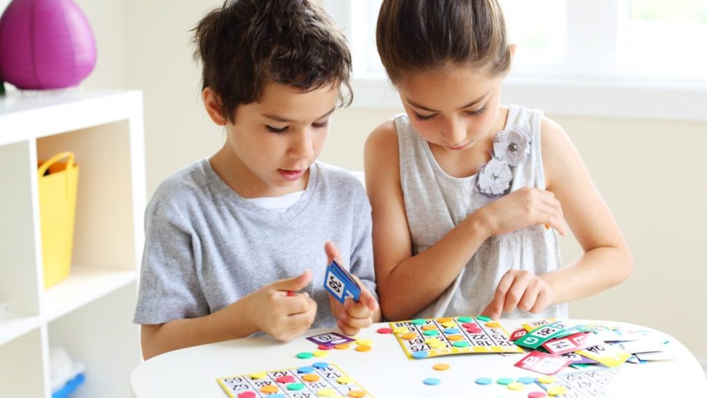 Two kids playing bingo