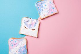 Unicorn and mermaid toasts with stars, food for kids idea, top view on a blue and pink background, a fun recipe you can make with your kids this summer