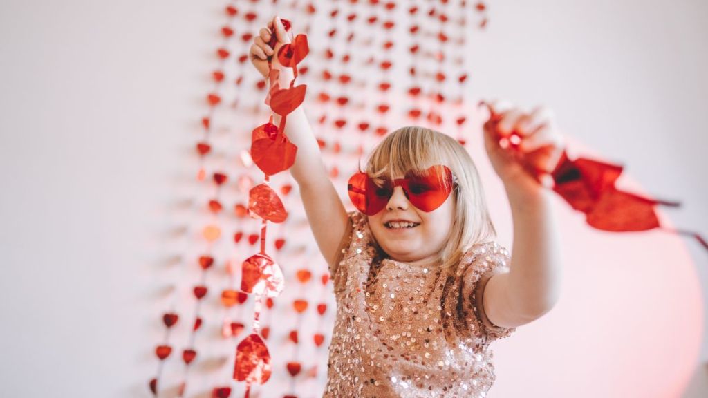 Happy little girl enjoying Valentine's day