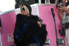 Kourtney Kardashian stands on the side of the stage as her husband Travis Barker performs with his band Blink-182 during the first week-end of Coachella Valley Music and Arts Festival in Indio, California, on April 14, 2023.