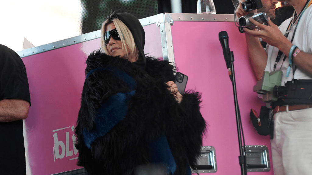 Kourtney Kardashian stands on the side of the stage as her husband Travis Barker performs with his band Blink-182 during the first week-end of Coachella Valley Music and Arts Festival in Indio, California, on April 14, 2023.