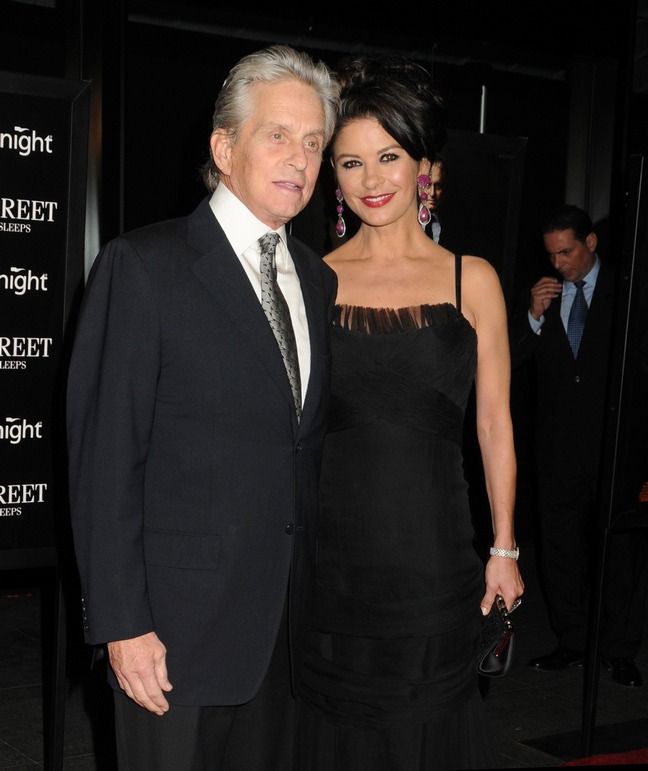 Michael Douglas, black suit, Catherine Zeta-Jones, emerald earrings, black spaghetti strap dress